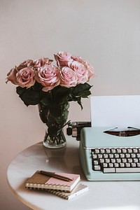 Retro mint typewriter by pink roses
