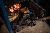 Shovel with coal for the fire pit