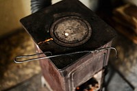 Fireplace tong on a cast iron wood stove