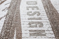 Red paved cobblestone road mockup covered in snow 