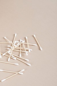 Natural cotton buds isolated on beige background