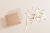 Natural cotton buds and brown packaging