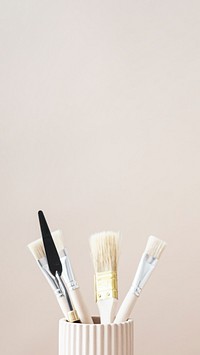Paintbrushes and art tools in a cup