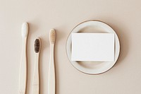 Bamboo toothbrushes and a white blank card