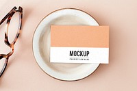 Business card on a plate with glasses mockup