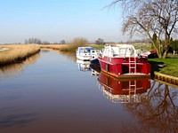 Free boat moored to dock in canal image, public domain CC0 photo.