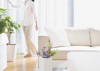 Free woman in white living room image, public domain people CC0 photo.