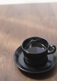 Free black coffee cup top view on wooden table background photo, public domain beverage CC0 image.