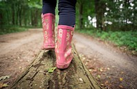 Free kid wearing pink rain boots photo, public domain shoes CC0 image.