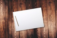 Free open notebook on wooden table photo, public domain CC0 image.