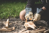 Free person cutting wood pieces image, public domain CC0 photo.