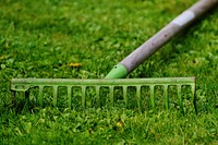 Rake left in the grass, free public domain CC0 image.