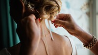 Hairdresser fixing bride's hair, free wedding public domain CC0.