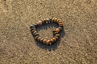 Free heart shaped stones on the beach image, public domain CC0 photo.