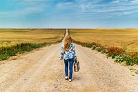 Free woman walking on road image, public domain CC0 photo.