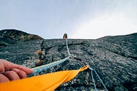 Free people climbing mountain cliff photo, public domain nature CC0 image.