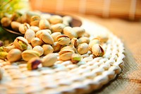 Free pile of pistachio nuts on table photo, public domain food CC0 image.