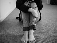 Free person hugging legs image, public domain human CC0 photo.