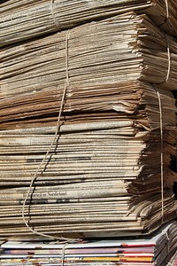 Old stacked newpapers, free public domain CC0 image.