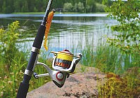 Free fishing rod by the lake image, public domain hobby CC0 photo.