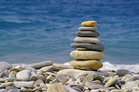 Free stacked pile of rocks near beach image, public domain CC0 photo.