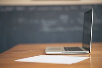 Free side view of laptop and paper on table image, public domain CC0 photo.