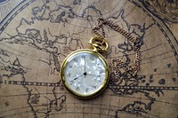 Free pocket watch on map image, public domain CC0 photo.