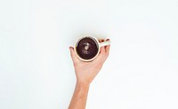 Free hand holding coffee cup top view in white background photo, public domain beverage CC0 image.