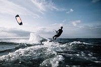 Free man kitesurfing in ocean photo, public domain sport CC0 image.