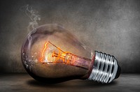 Free light bulb, black background image, public domain electricity CC0 photo.