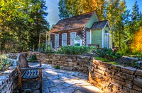 Free tiny house surrounded by trees photo, public domain building CC0 image.