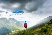 Man standing on mountain image, public domain travel CC0 photo.