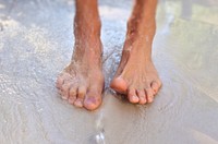 Free feet on beach closeup image, public domain CC0 photo.