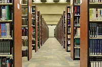 Free library shelves with many books photo, public domain CC0 image.