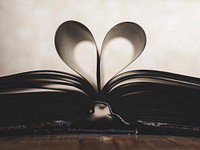 Free open book with heart shaped pages photo, public domain CC0 image.