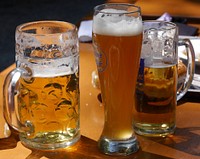 Free beer mugs on the table photo, public domain beverage CC0 image.