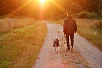 Man walking dog, free public domain CC0 photo.