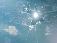 Free sky with sun flare through broken glass photo, public domain view CC0 image.