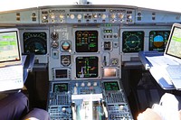 Free pilot studyin gin the cockpit image, public domain CC0 photo.