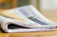 Free newspaper on table closeup image, public domain CC0 photo.