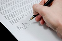 Free hand holding pen signing signature image, public domain CC0 photo.