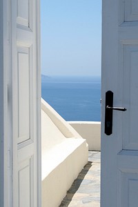 Free door opening to sea view photo, public domain travel CC0 image.