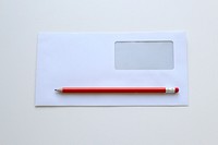 Free pencil and envelope with window public domain CC0 photo.