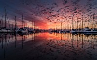 Free view of pier with boats at sunset image, public domain CC0 photo.