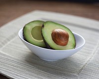 Free avocado cut up in half in a bowl image, public domain CC0 photo.