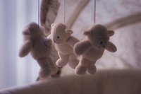 Free baby soft toy hanging, public domain CC0 photo.