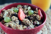 Free granola and fruit bowl closeup photo, public domain CC0 image.