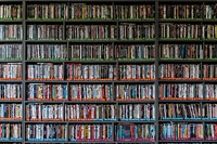 Free library shelves with many books photo, public domain CC0 image.