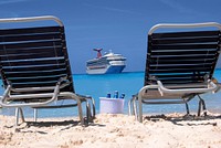 Free two beach chairs on the beach with drinks and a cruise view image, public domain CC0 photo.