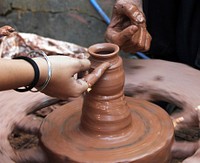 Free person making handmade pottery photo, public domain ceramics CC0 image.